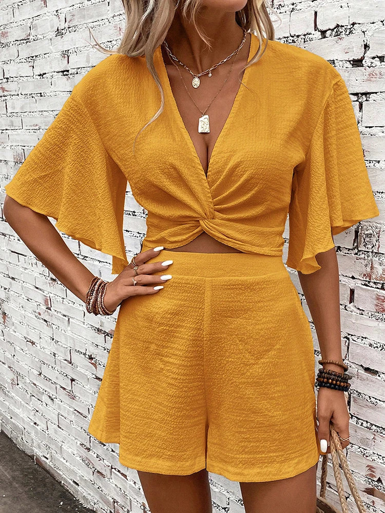 Vasilina - Elegant deep V-neck batwing top and high-waist shorts set
